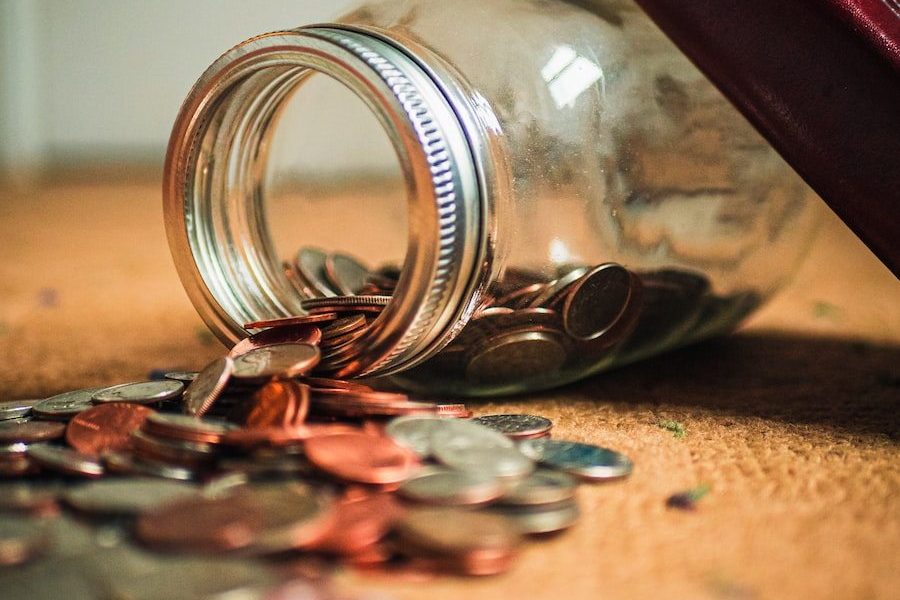 assorted coin lot in clear glass jar